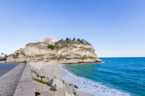 Former 4th century monastery on top of the Sanctuary of Santa Maria Dell'isola - Tropea, Calabria, Italy. Tropea Beach at Tyrrhenian Sea.